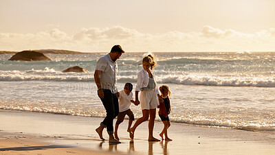 Buy stock photo Parents, children and holding hands for sunset by ocean with waves, outdoor and connection on holiday. People, family and kids with care, love and bonding in nature for vacation at beach in Italy