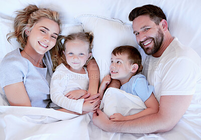 Buy stock photo Bed, happy and portrait of parents with children for relax, resting and comfortable in morning. Family, love and mother, father and kids in blanket for bonding, relationship and home on weekend above