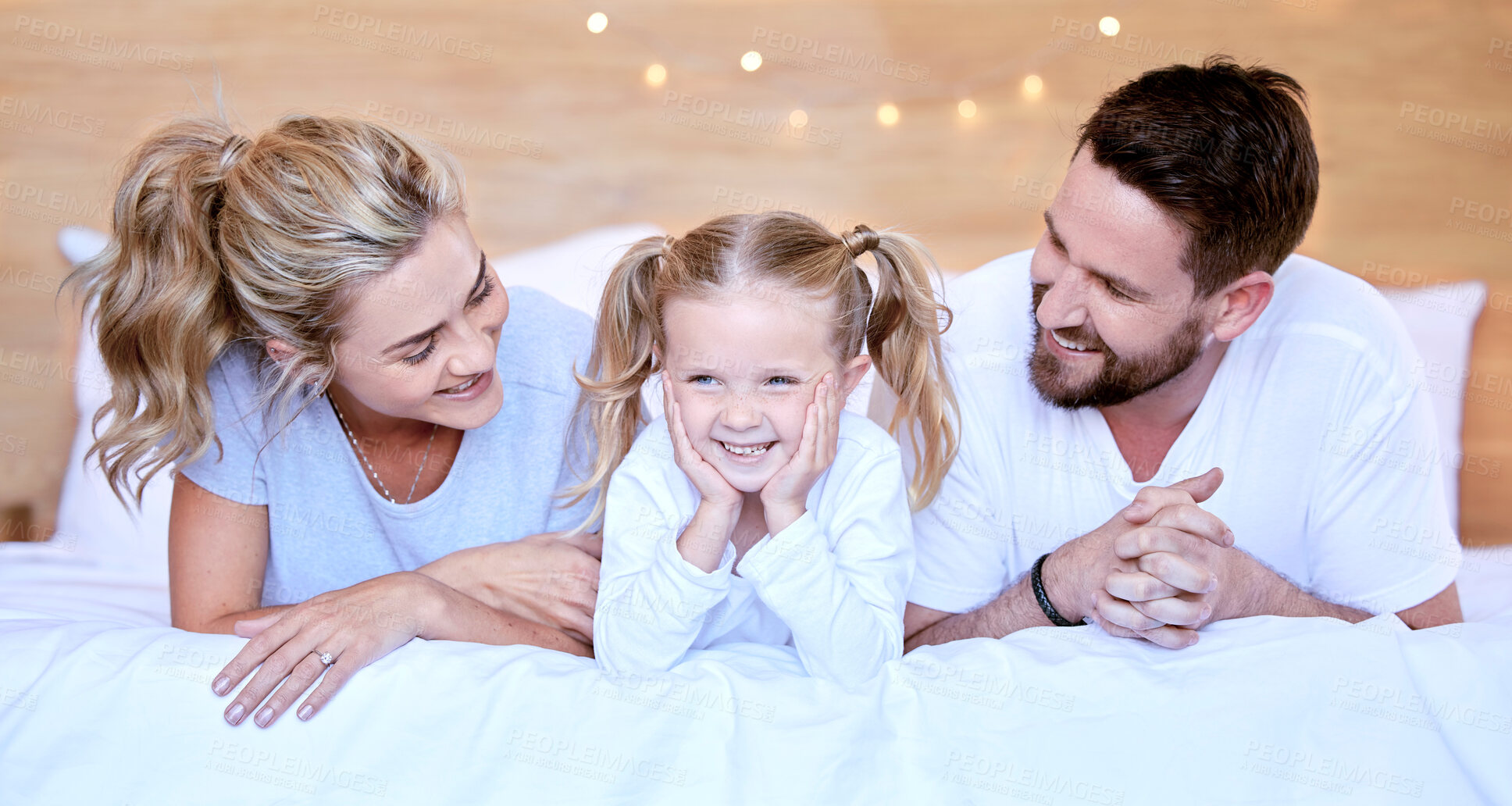 Buy stock photo Bed, happy and mom, dad and child in home for relax, resting and comfortable in morning. Family, love and mother, father and girl in blanket for bonding, relationship and care on weekend together