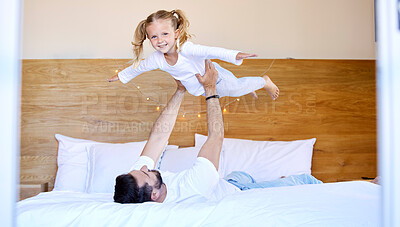 Buy stock photo Dad, airplane and girl for play in home, bedroom and fun for weekend bonding with trust. Flying, playful and support with family and love with male person and child, smile and family together in home