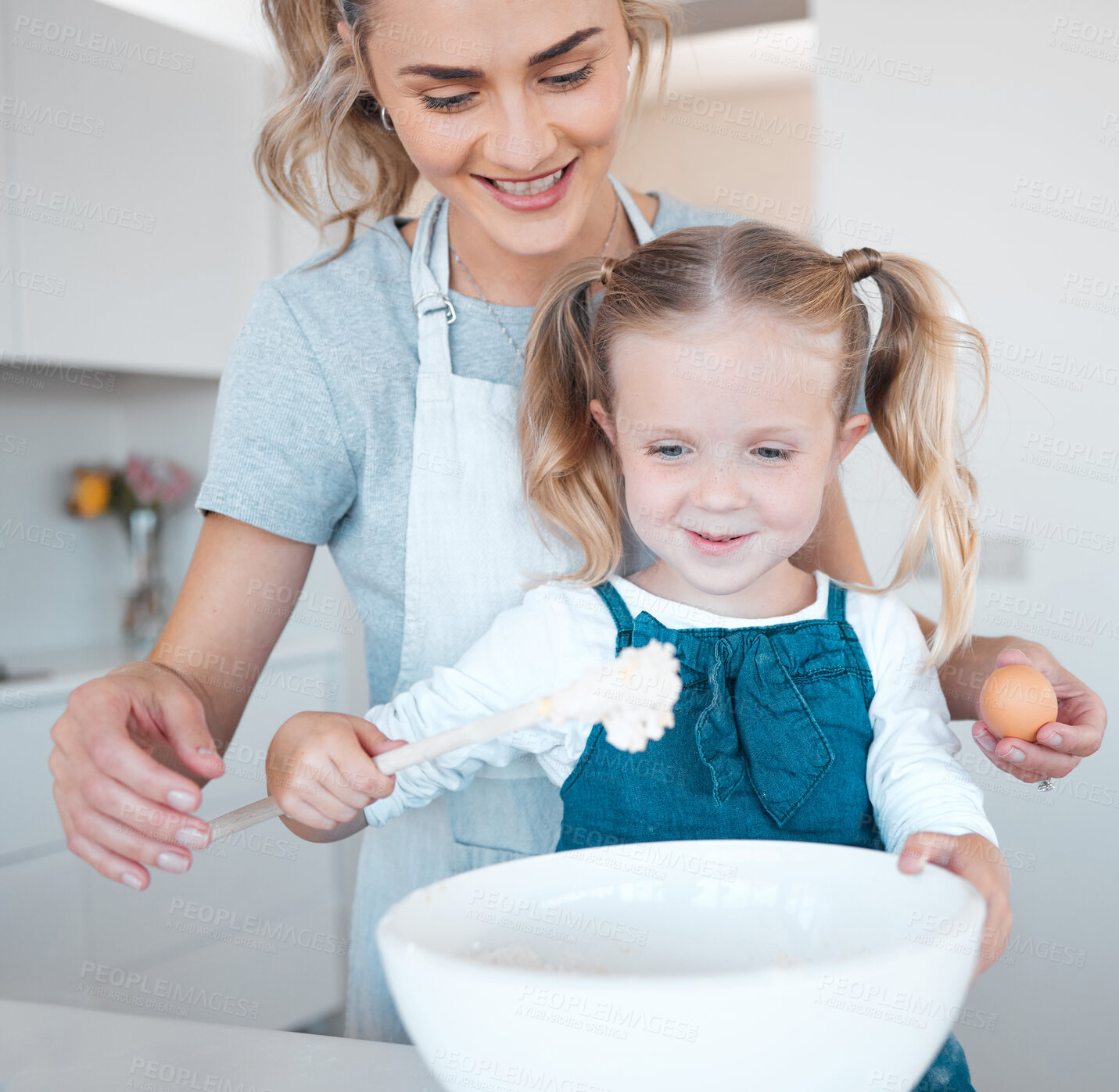 Buy stock photo Kitchen cooking, mama and learning kid baking, happy and help prepare egg, flour or food ingredients. Mother, love and family fun or woman bonding with daughter, child development support and care