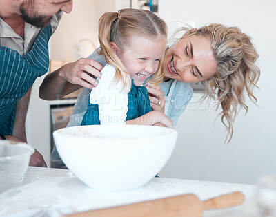 Buy stock photo Kitchen, baking and family with laughing girl, cooking and happy for help prepare ingredients in home. People, love and fun with mother father and bonding for child development, support and care