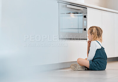 Buy stock photo Child, oven and wait for cooking or baking food in kitchen at home with learning. Hungry, girl watching and youth development with recipe and culinary lesson with care, mockup and patience on floor