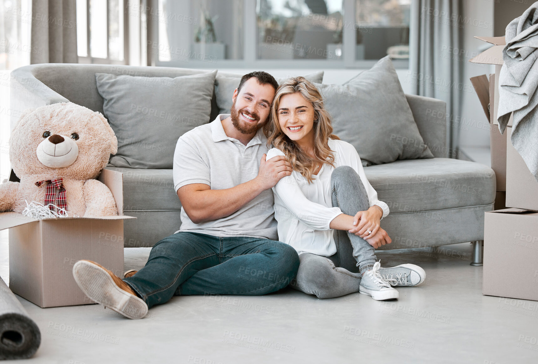 Buy stock photo Couple, portrait and smile with boxes, clothes and teddy bear for moving, celebration and new home. People, cardboard and happiness for real estate, apartment and property with investment on floor