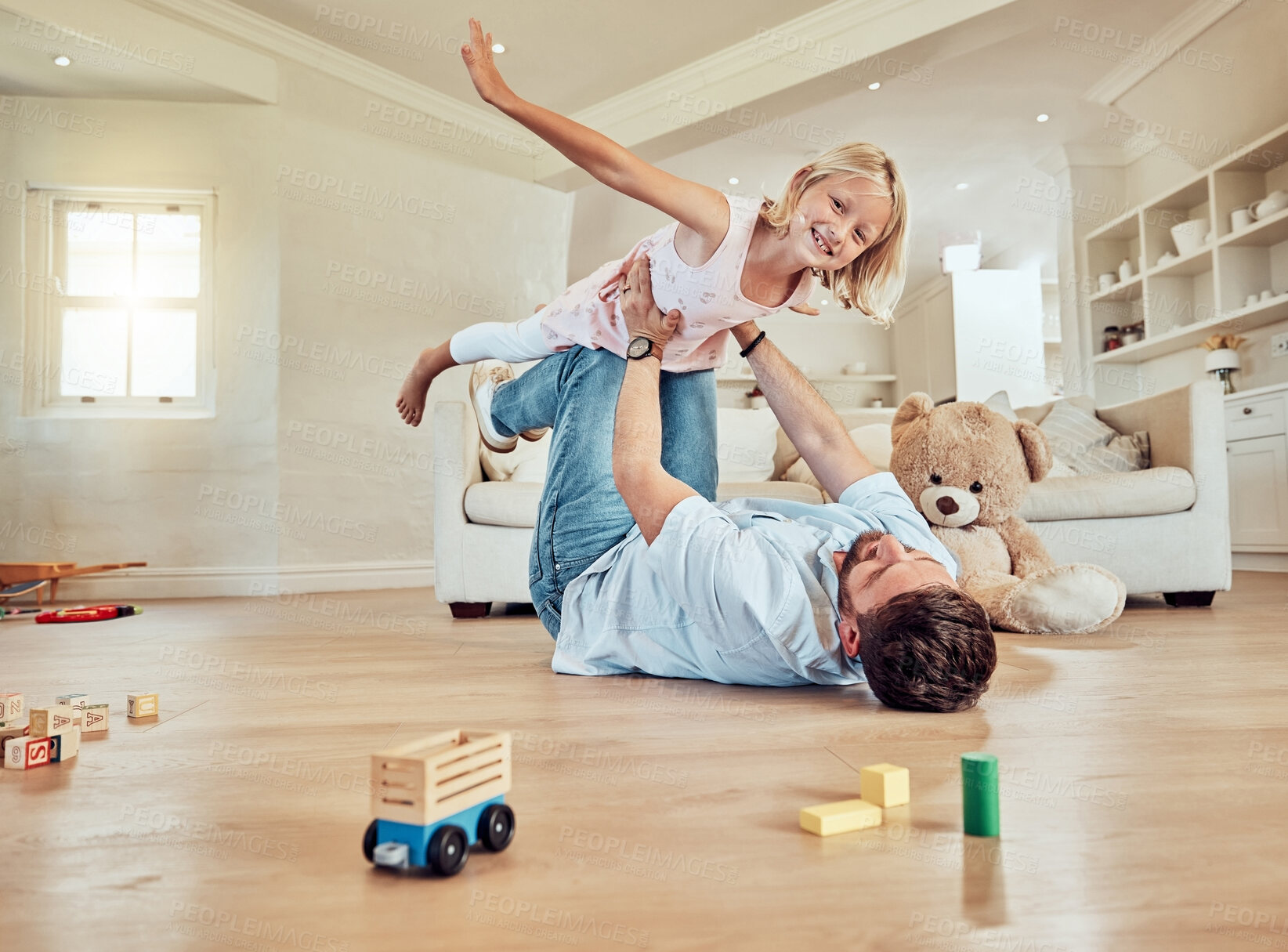 Buy stock photo Girl, dad and portrait for airplane game in home with bonding together, parent trust and smile. Lounge floor, father and balance daughter for flying fantasy with love relationship, energy and support