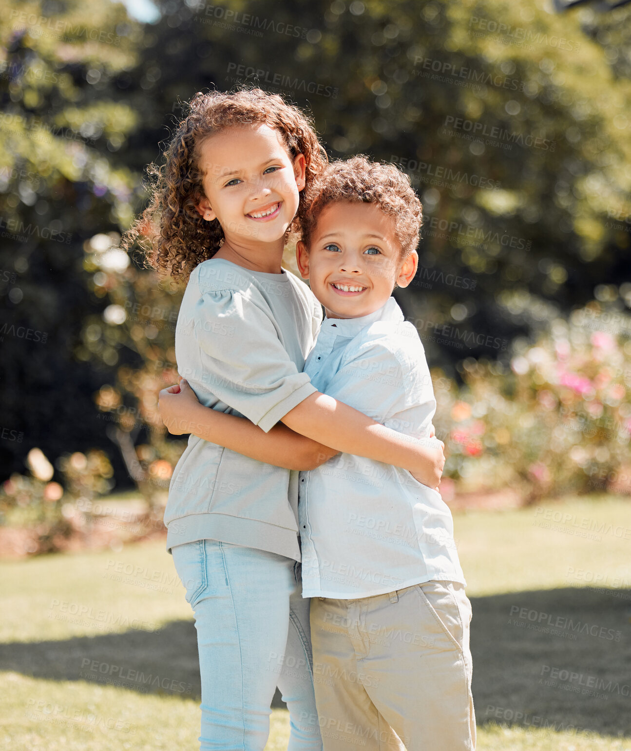 Buy stock photo Hug, portrait and smile of sibling children outdoor in garden for love, safety or security. Happy, kids or trust with brother and sister embracing in backyard of home for relationship or support