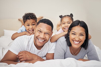 Buy stock photo Morning, family and children with portrait on bed for bonding, connection or relax together in bedroom. Parents, young kids and happy man with woman playing for love, hug or care in home on weekend