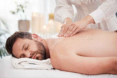 Buy stock photo Relax, spa and man with back massage, therapist and  wellness on table for luxury holistic treatment. Self care, masseuse and client on bed for body health, muscle care and peace with hotel service