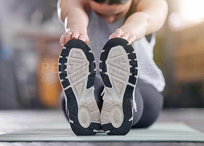 Buy stock photo Woman, shoes and stretching in closeup for fitness, exercise and wellness with motivation or commitment. Athlete, feet and hands as legs warm up for training, workout or injury risk management in gym