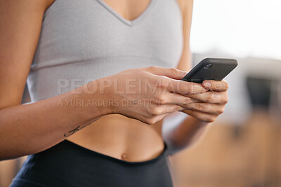 Buy stock photo Hands, phone and woman in gym on fitness mobile app browsing for body building workout routine. Health, research and female athlete with cellphone for exercise tutorial online in sports center.