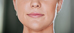 Closeup of unknown serious woman alone in gym. Headshot of focused caucasian trainer’s lips and mouth while standing after workout in health club. Coach in fitness centre for routine exercise training