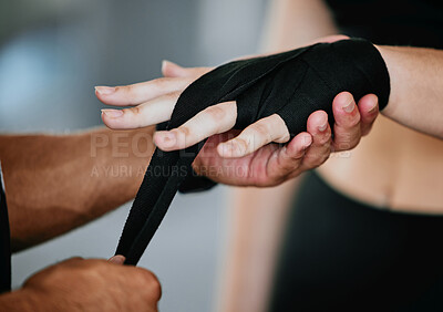 Buy stock photo Hands, personal trainer and tape in gym for boxing, fitness and training for mma or workout. Athlete, protection and support with bandage for performance and challenge or competition in fight club