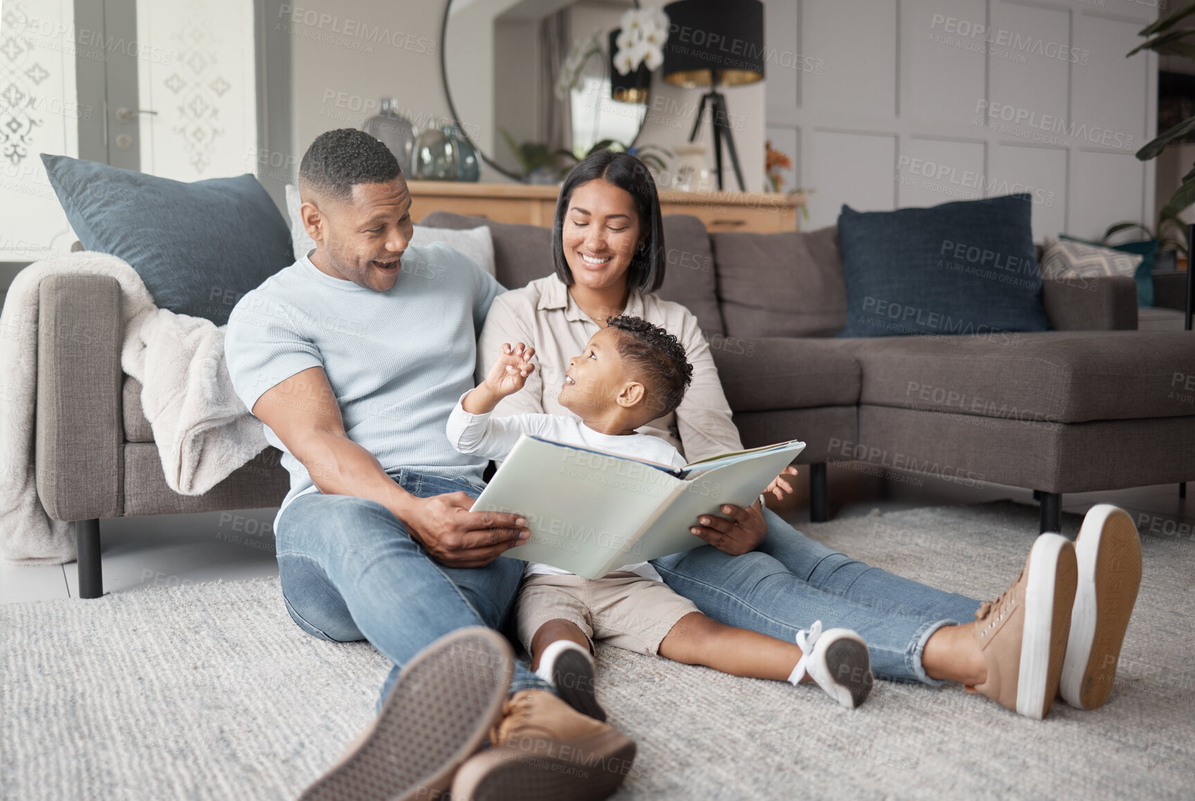 Buy stock photo Mother, father and happy child reading books on living room floor for educational fun, learning and development at home. Family, parents and storytelling with boy kid for love, care or play in lounge