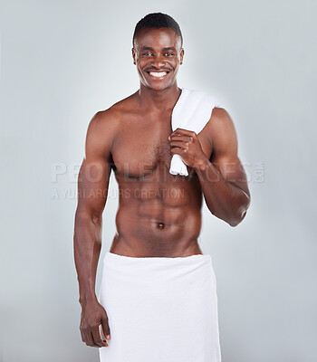 Buy stock photo Black man, muscle and portrait smile with towel for morning shower, hygiene and skincare in studio. African person, body cloth and cleaning with dermatology, wellness and happy by white background