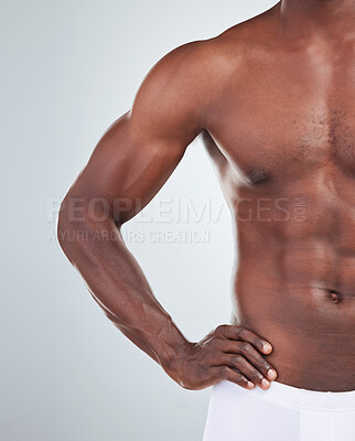 Buy stock photo Black man, muscle and half of body in studio for fitness, bodybuilding and stomach on white background. Muscular, male athlete and bodybuilder abs with confidence for biceps, health and wellness