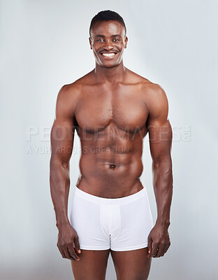 Buy stock photo Black man, muscle and underwear portrait in studio with wellness, fitness and progress for workout. African bodybuilder, body skin and abs for exercise, sport training and health by white background