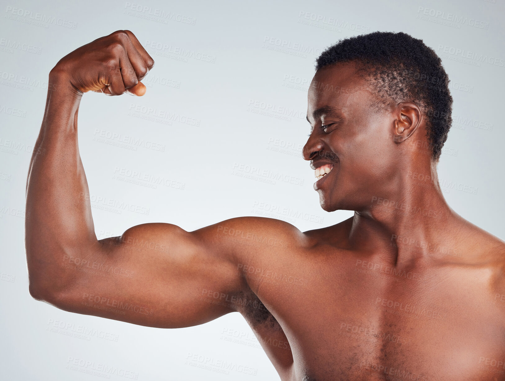 Buy stock photo Flexing, bicep and black man with face in studio with fitness for muscle growth, strong body and power. Athlete, happy and topless with arm strength, healthy and wellness on gray background mockup