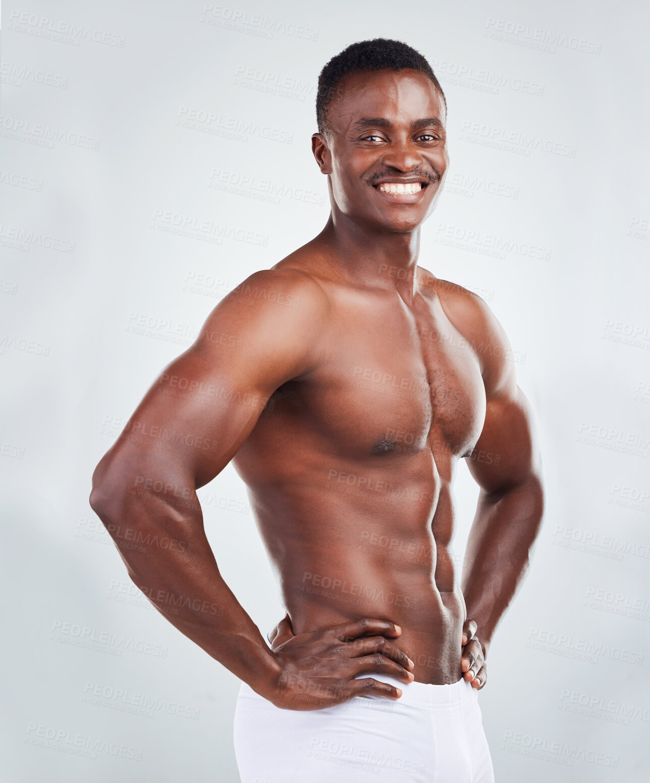 Buy stock photo Topless, black man and portrait in studio with fitness for muscle growth, strong body or power. Athlete, happy and muscular with biceps strength, underwear or wellness on gray background mockup space