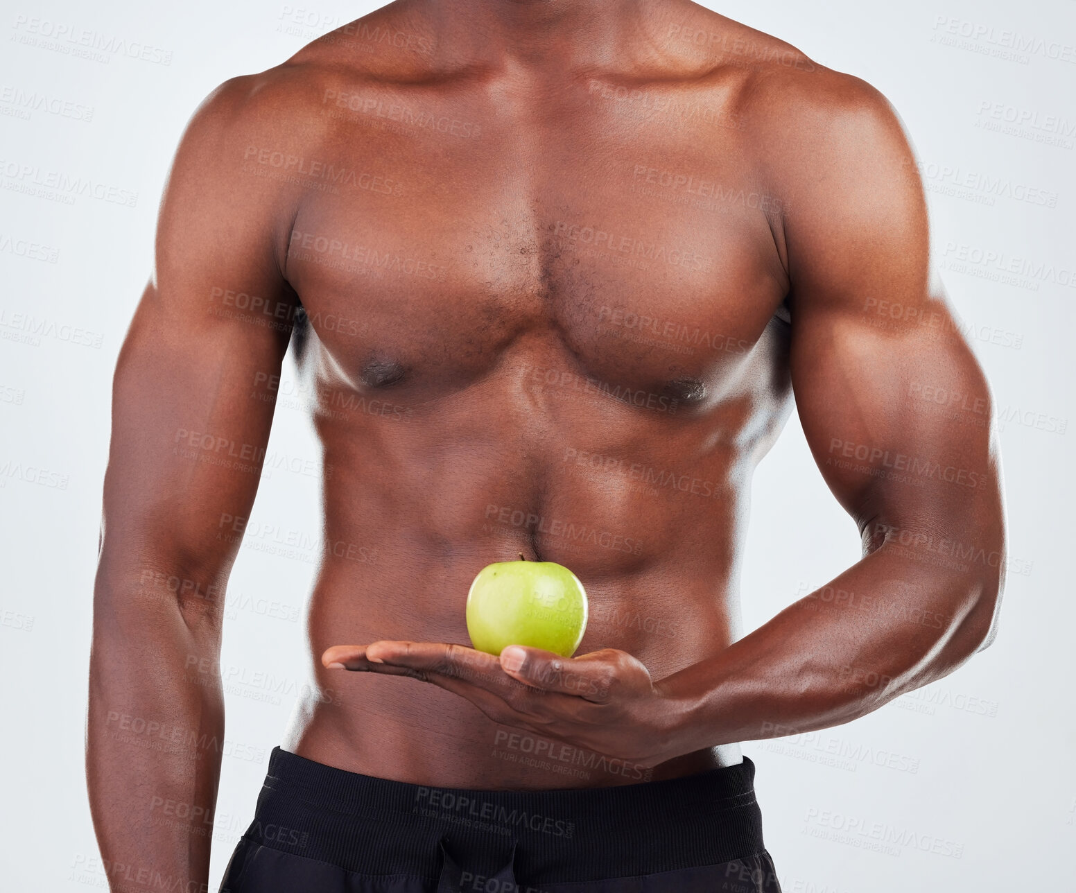 Buy stock photo Apple, body and black man in studio for diet, health and wellness for gym balance with nutrition. Muscles, snack and shirtless African male person with organic fruit for vitamins by white background.