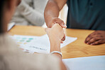 Handshake, contract deal or negotiation closeup at desk at a meeting between professionals. Business greeting, thank you or welcome gesture to show respect with new partnership or onboarding.