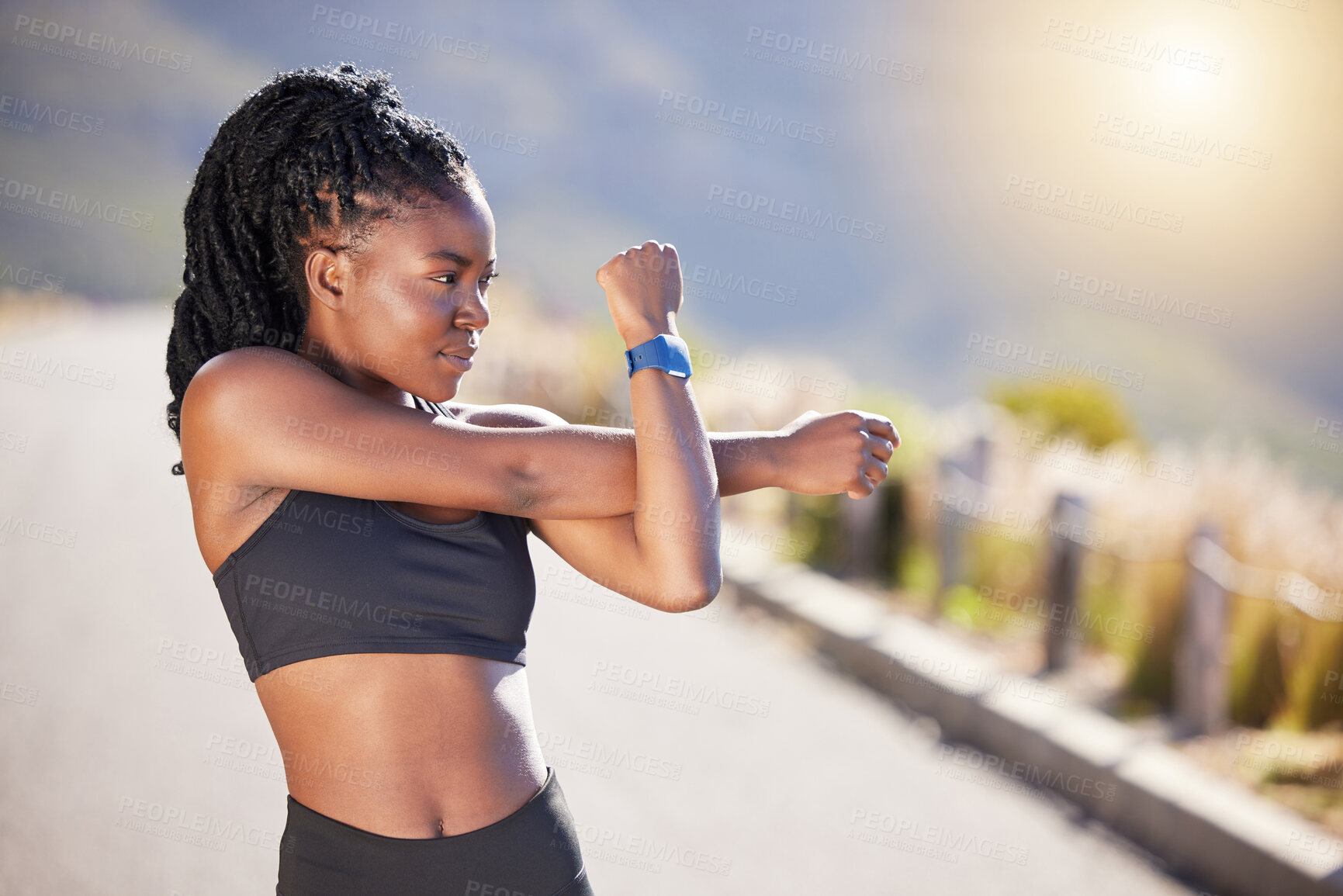 Buy stock photo Black woman, thinking and stretching arm in outdoor for warm up before running, workout and training for marathon. Girl, exercise and ready for practice on road, fitness routine and prepare for race.