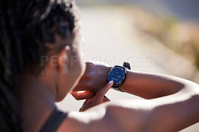 Buy stock photo Woman, smart watch and checking with time on mountain road for fitness, running or start workout in nature. Back of active female person or runner on wristwatch or screen for clock, race or tracking