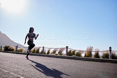 Buy stock photo Girl, running and athlete on road for fitness or training, exercise and physical cardio for marathon. Female runner, wellness and practice for race outdoor, speed and fast with endurance for workout.