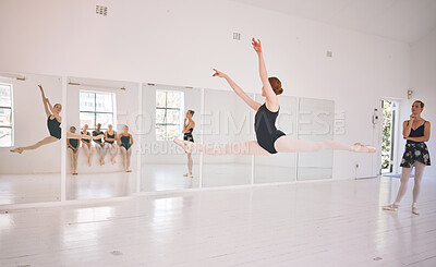 Buy stock photo Jump, woman and girl in class, ballet and teaching of dancing to students, grace and practice. Training, creative and dancer with performance, teacher and academy for talent and coaching of sport