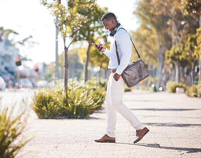 Buy stock photo Outdoor, business and black man with smartphone, typing and walking in city, texting and social media. African person, employee and consultant with cellphone, message and online reading with smile