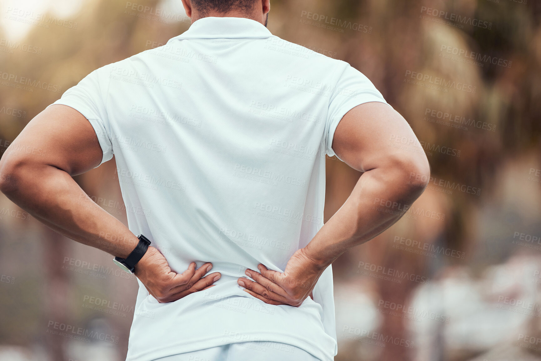 Buy stock photo Backache, tennis and person with pain, outdoor and suffering in court for competition, player and sports. Injury, uniform and man with strain of muscle, rubbing and athlete with massage in field