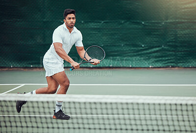 Buy stock photo Playing, tennis and man with performance, serious and energy for match, court and fitness for sports. Outdoor, action and game for person, active and morning for contest, athlete and challenge