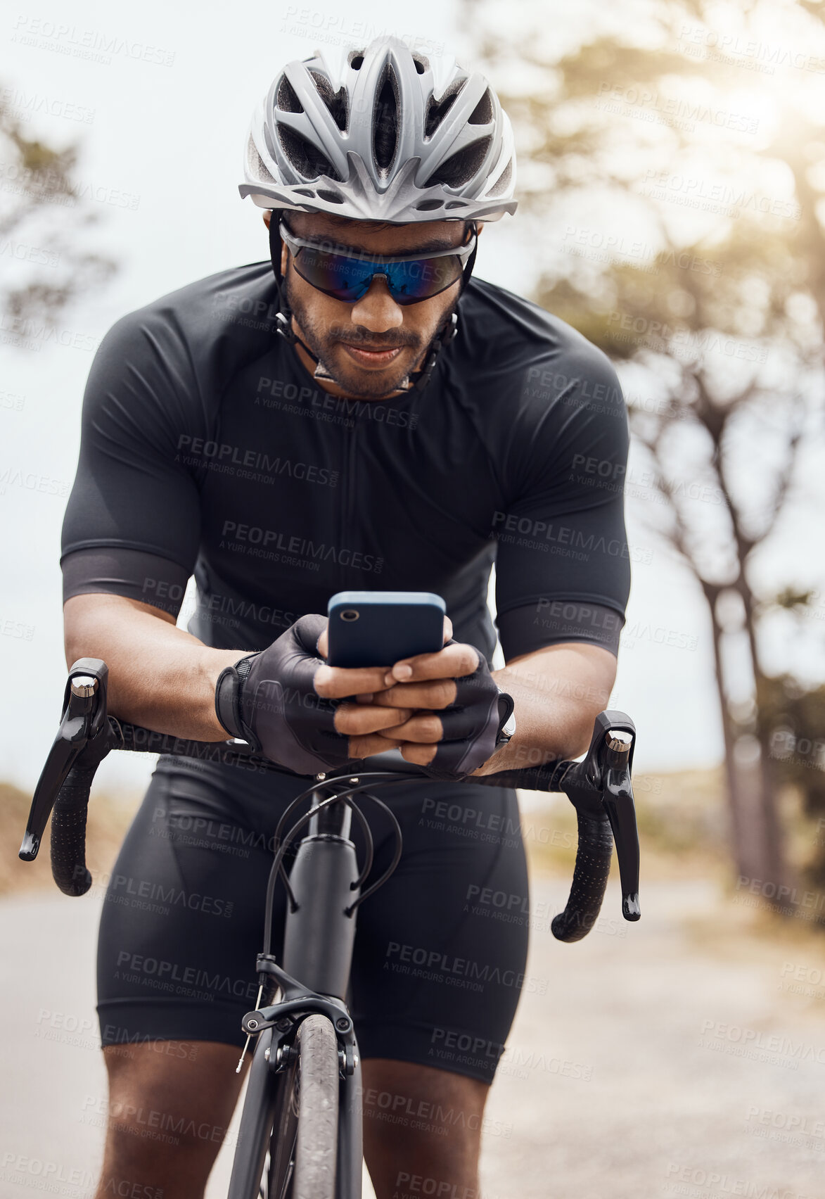 Buy stock photo Phone, bicycle and athlete with cycling app for fitness, workout and training tracking outdoor. Map, navigation and mountain bike route with internet, website and typing for direction with mobile