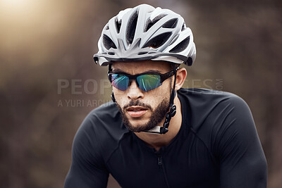 Buy stock photo Man, cyclist and racing with helmet, sunglasses and cycling for sport, exercise and adventure. Male person, fitness and safety as athlete for training, physical activity and wellness on mountain road