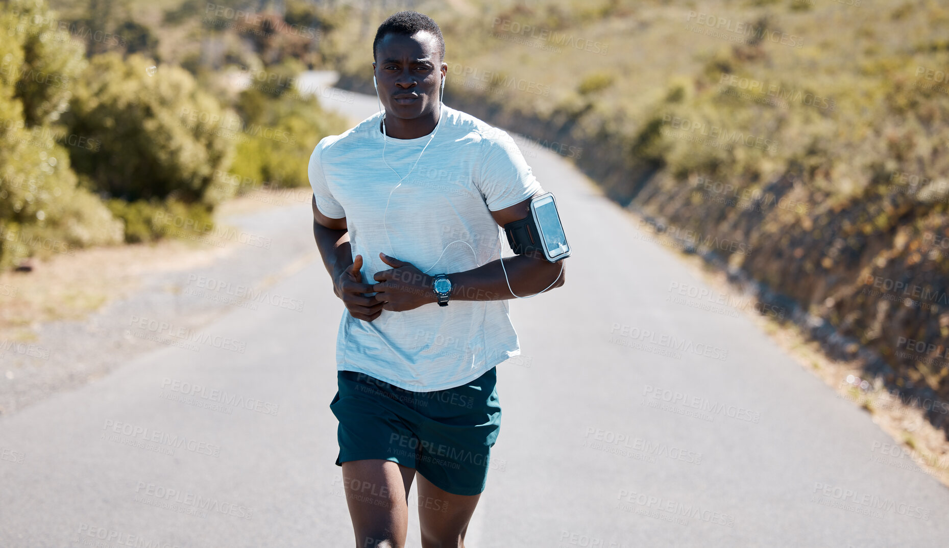 Buy stock photo Black man, health and running with earphones on road for music, workout or outdoor cardio in nature. Active African, runner or male person in sprint or fitness with audio on street for exercise