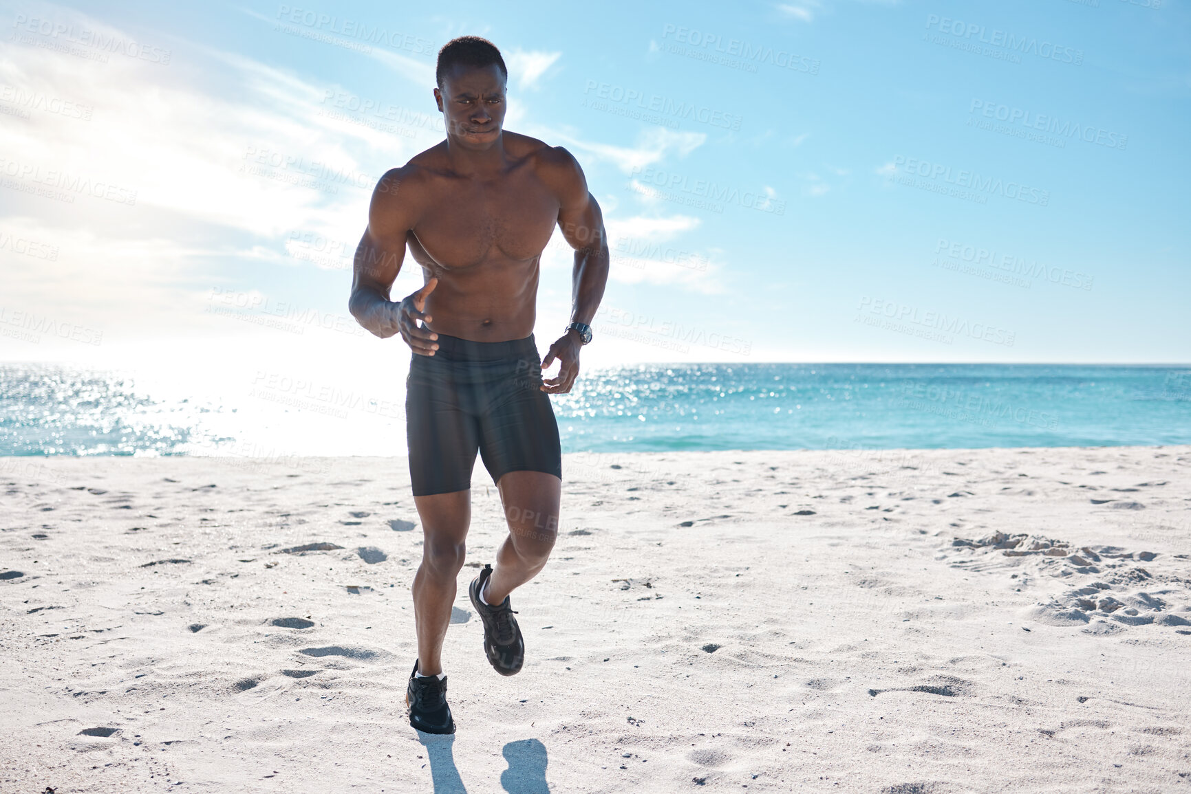 Buy stock photo Athlete, fitness and running on beach for workout, exercise and cardiovascular health outdoor. Black man, jog and high intensity training by ocean with sand, sun and water for speed and performance