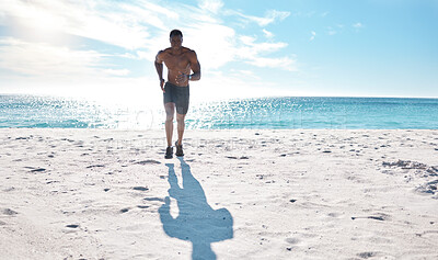 Buy stock photo Athlete, fitness and running on beach for exercise, workout and cardiovascular health outdoor. Black man, jog and high intensity training by ocean with sand, sun and water for speed and performance