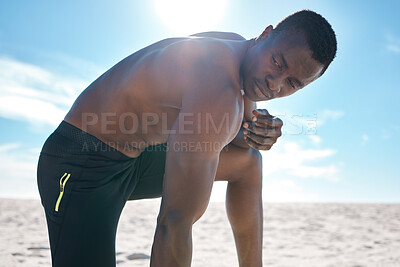 Buy stock photo Black man, topless and rest for workout or jog on beach as athlete in summer for morning exercise. Strong, African and male person on break for sports, training and run in USA for fitness or muscle