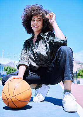 Buy stock photo Basketball court and portrait of woman with street fashion with trendy and urban outfit for style. Confident, sports and female person with curly hair and edgy outfit for gen z energy in outdoor