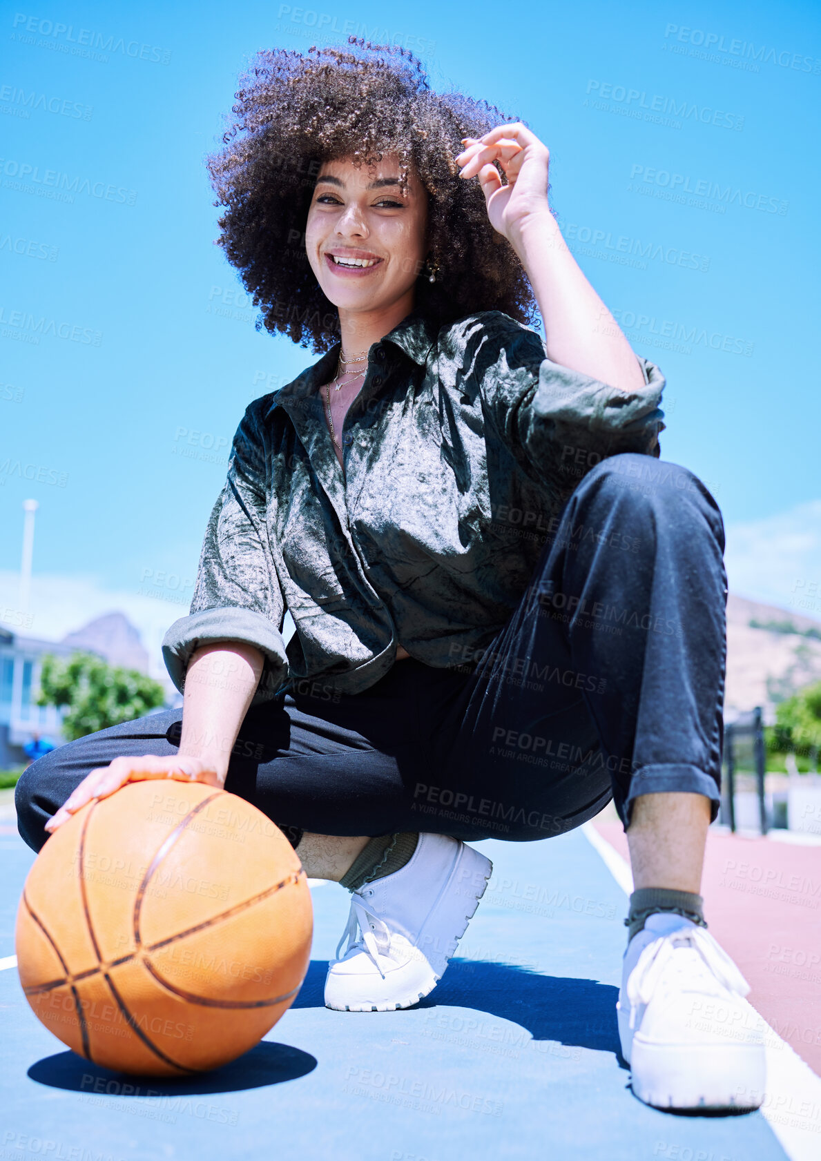 Buy stock photo Basketball court and portrait of woman with street fashion with trendy and urban outfit for style. Confident, sports and female person with curly hair and edgy outfit for gen z energy in outdoor