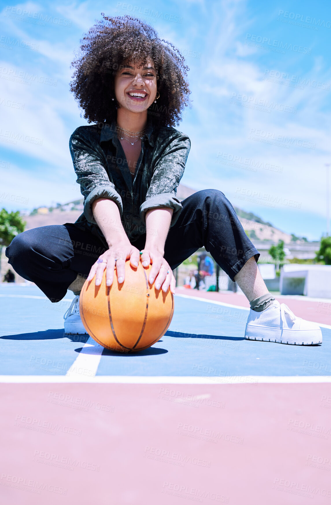 Buy stock photo Basketball court, portrait and woman with urban style with trendy, street and fashion. Confident, sports and female model with curly hair and cool edgy outfit for gen z swag energy on outdoor field.