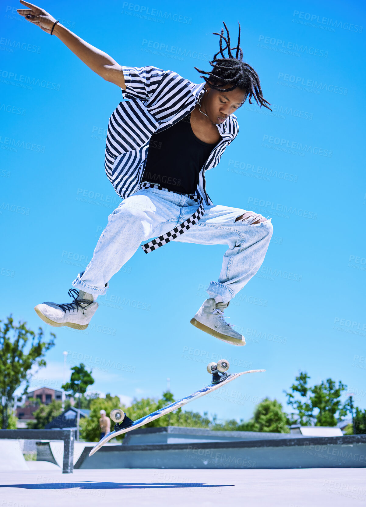 Buy stock photo Skateboard, park and black man with trick in air for jump stunt, practice and energy in summer  Blue sky, skater and male person with ollie flip on concrete for outdoor talent, competition and hobby