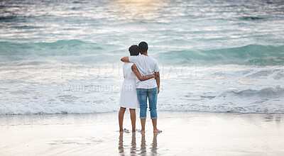 Buy stock photo Sunset, black couple and waves with love, beach and celebrating together for anniversary. Vacation, honeymoon and people relax with romance, travel and marriage on summer holiday and Miami ocean