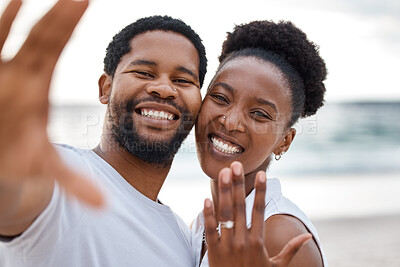 Buy stock photo Portrait, black couple and selfie of engagement, outdoor and showing of ring, happy and celebrating. Vacation, man and woman in California for commitment, beach and holiday for proposal and love