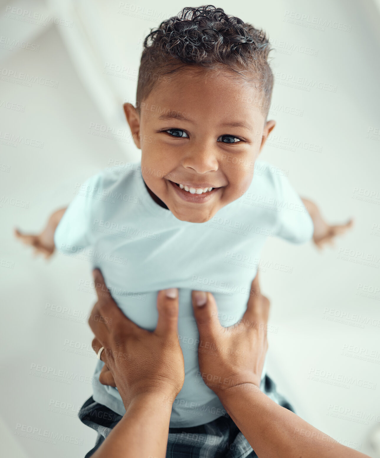 Buy stock photo Face, boy and happy with flying in bed at home for fun to relax, bonding and care in Brazil. People, kid and smile in bedroom with playing on portrait for child development and childhood memories