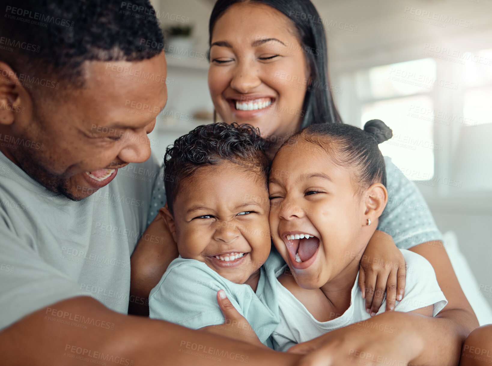 Buy stock photo Parents, children and laughing or having fun together for bonding, happy relationship and love in home. Mother, father and hug or tickling kids with comedy joke, crazy games and morning in apartment