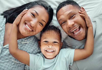 Buy stock photo Bedroom, parents and portrait of child above for connection, support and happy family laugh together. Face, father and mother with boy in top view for love, care and relax to rest with kid in house