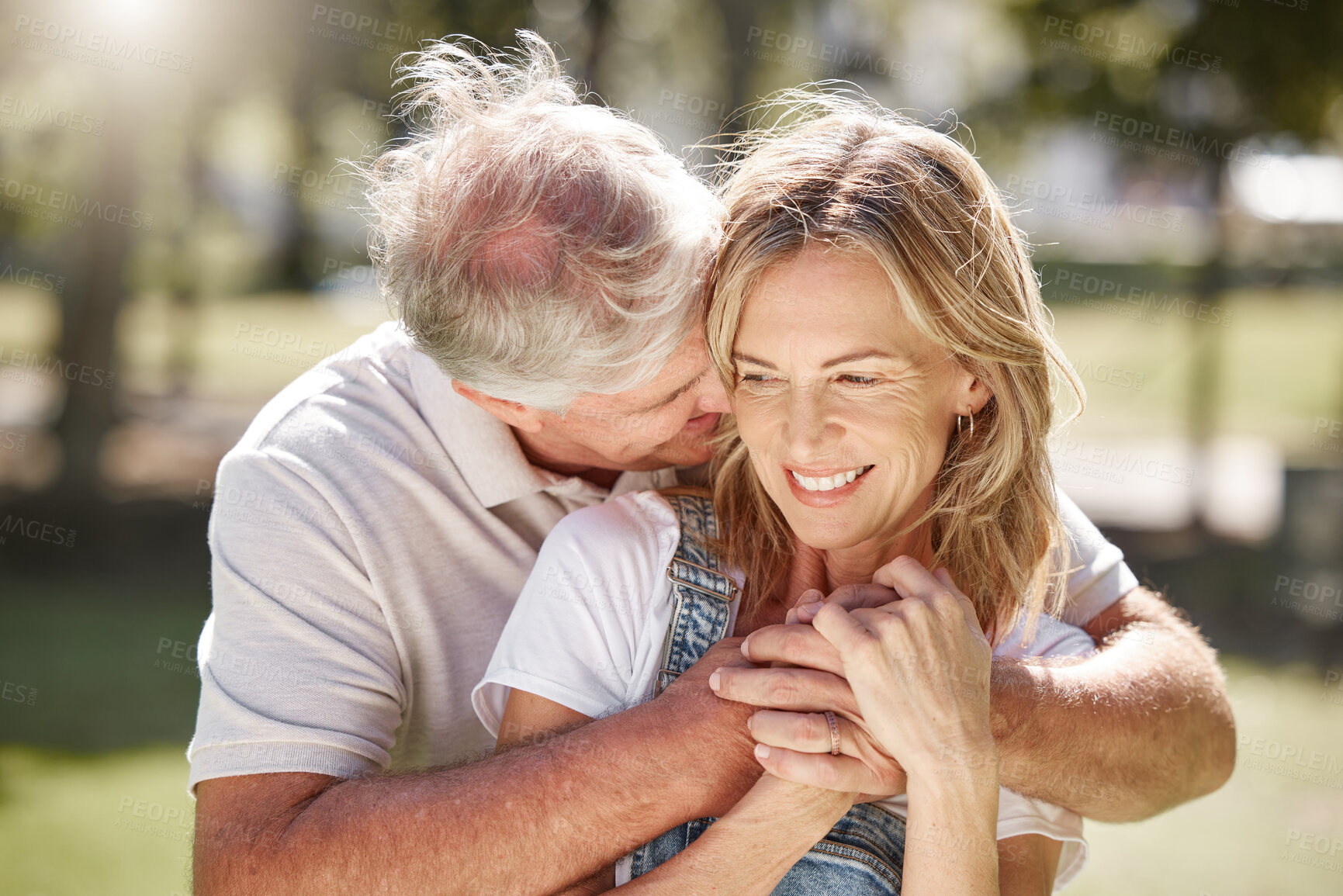 Buy stock photo Happy, senior and couple with kiss outdoor with love, commitment and relationship connection with trust. Elderly man, woman and together in park for bonding, date and enjoy retirement with care.