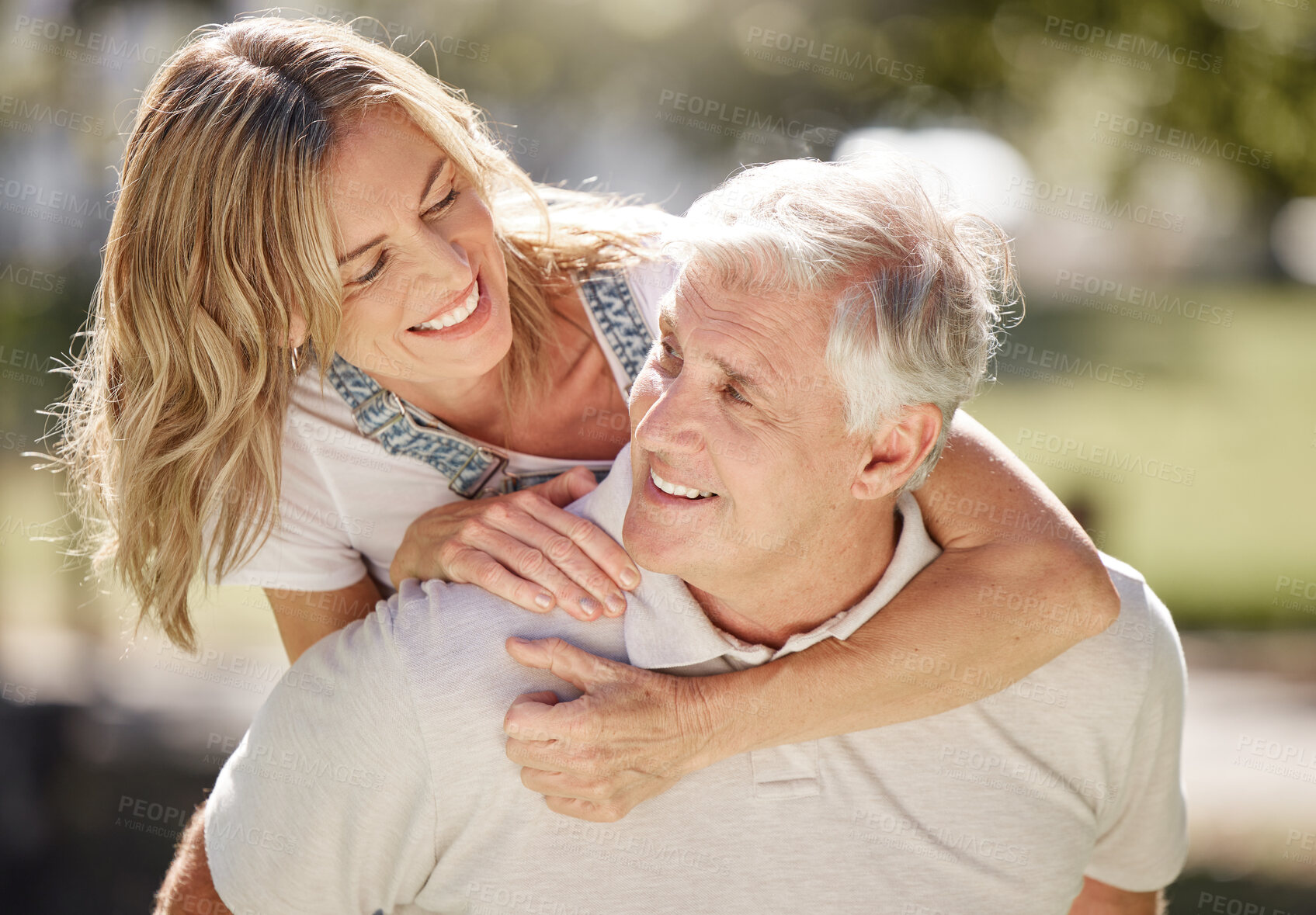 Buy stock photo Happy, senior and couple with piggyback outdoor with love, commitment and goofy relationship connection. Elderly man, woman and back hug together in park for silly, fun and enjoy retirement with care