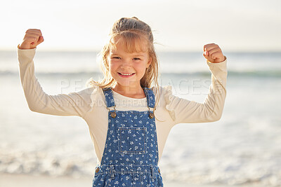 Buy stock photo Strong, child and portrait with muscles outdoor for healthy development, growth or confidence on beach. Girl, flexing arms and happy with power, holiday and independence with empowerment or wellness