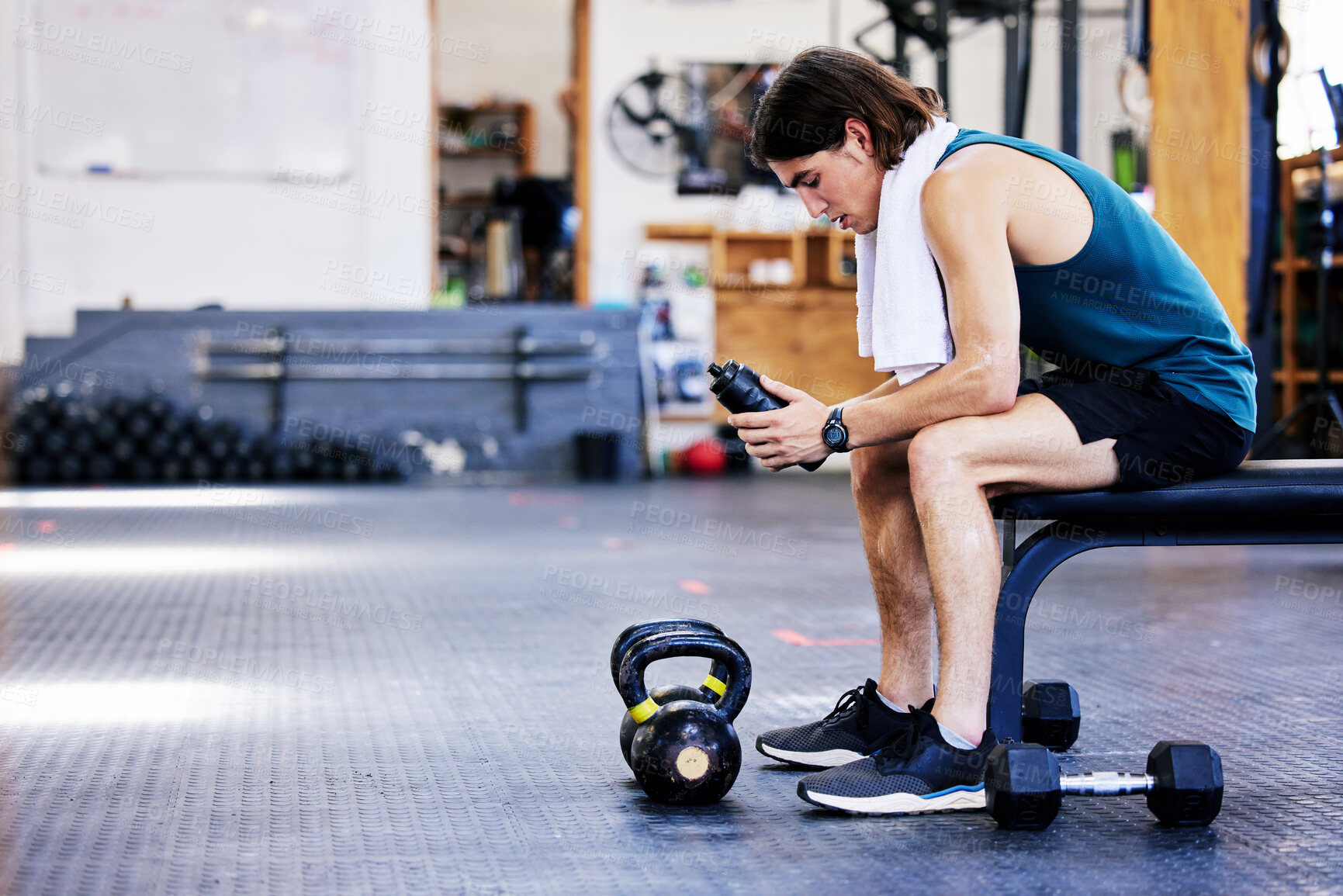 Buy stock photo Gym, rest and man for break on bench, fitness and drink water in wellness area. Breathe, workout and sports for exercise and training with weights, fatigues and health for recovery with hydration